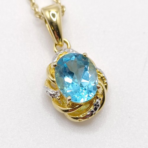 127 - A gold plated silver chain and pendant, set with an oval Swiss blue topaz and diamonds