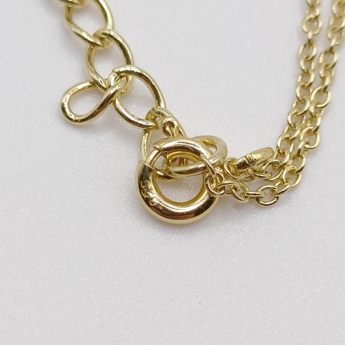 127 - A gold plated silver chain and pendant, set with an oval Swiss blue topaz and diamonds