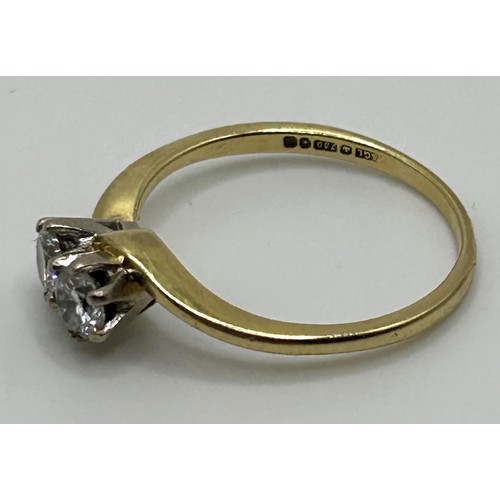 136 - An 18ct gold and diamond crossover ring, ring size M