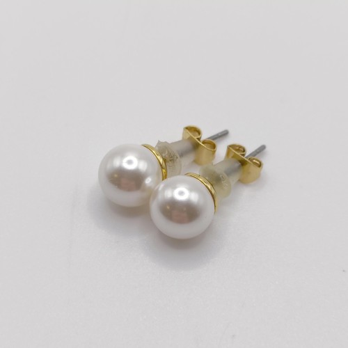 138 - A pair of silver solitaire studs, bezel set with white cubic zirconia, with plastic capped butterfly... 