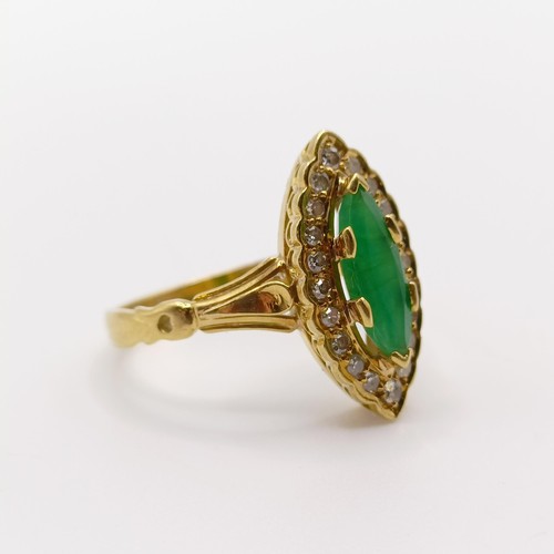 142 - An 18ct gold, diamond and emerald marquise shaped ring, ring size M