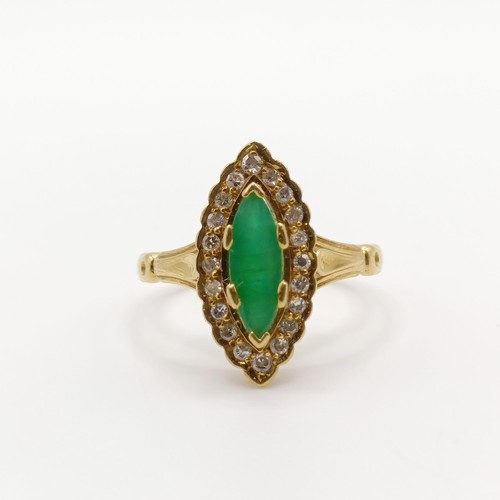 142 - An 18ct gold, diamond and emerald marquise shaped ring, ring size M