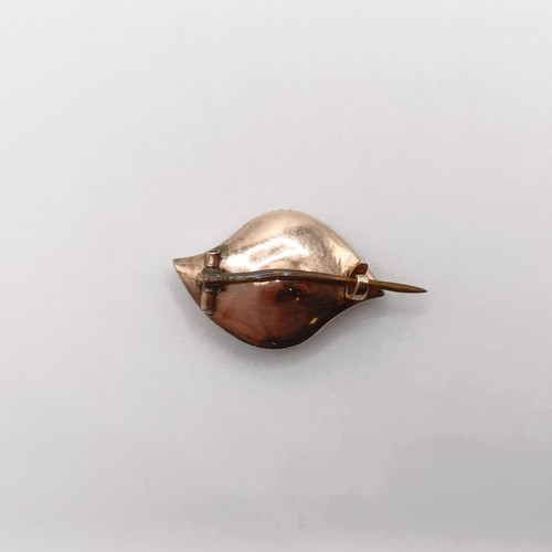 154 - A late 19th/early 20th century yellow stone and seed pearl eye brooch