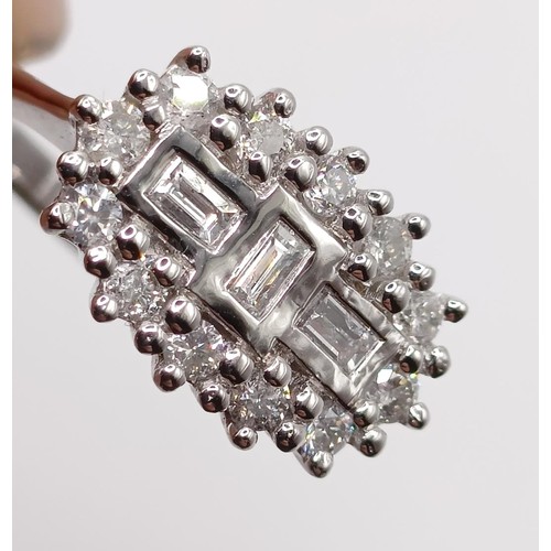 157 - A certificated 18ct white gold and diamond fancy cluster ring, RBC and baguette diamonds 0.50ct