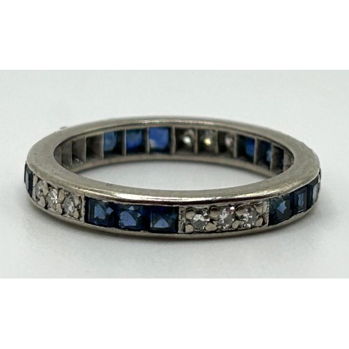 165 - A diamond and sapphire full eternity ring, ring size M