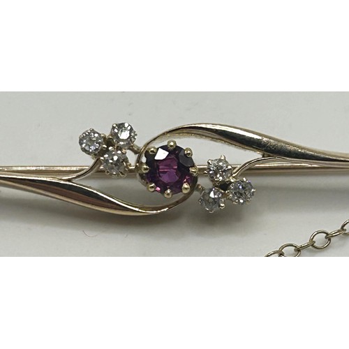 170 - A diamond and ruby bar brooch