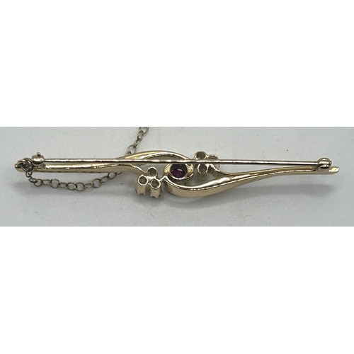 170 - A diamond and ruby bar brooch