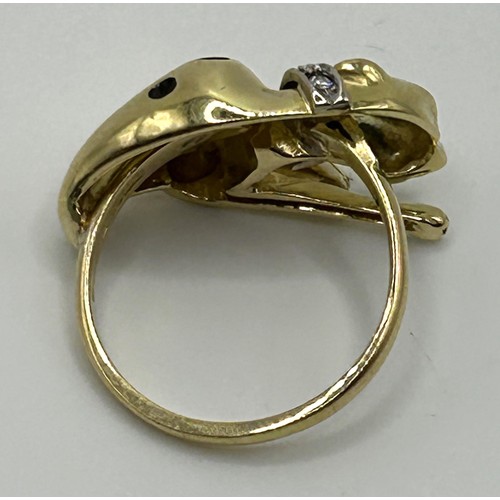 174 - An 18ct gold and gem set leopard ring, ring size M, 8.1 g all in