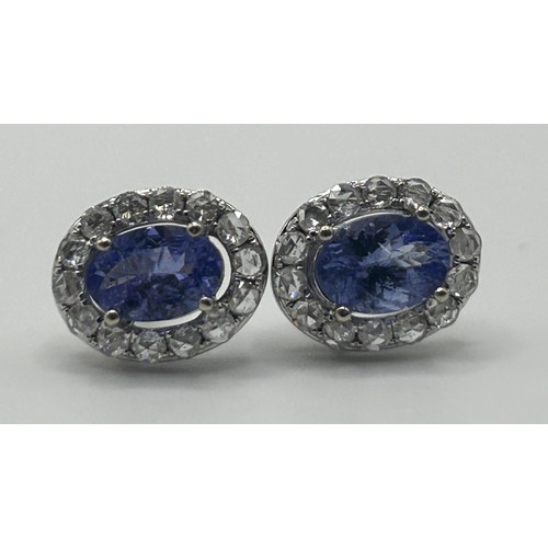 192 - A pair of 18ct white gold, tanzanite and diamond stud earrings