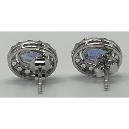 192 - A pair of 18ct white gold, tanzanite and diamond stud earrings