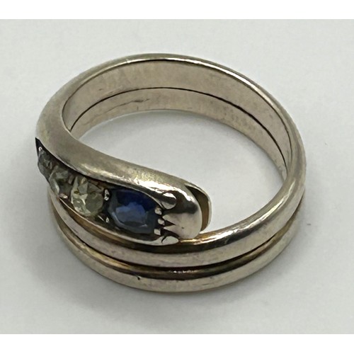 200 - A white coloured metal, diamond and sapphire serpent ring, ring size R, in a vintage jewellery box