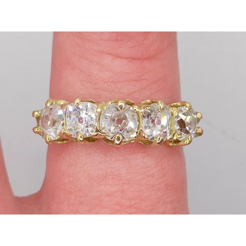 207 - An 18ct gold and five stone diamond half hoop ring, ring size J