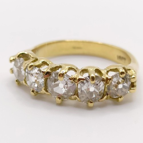 207 - An 18ct gold and five stone diamond half hoop ring, ring size J