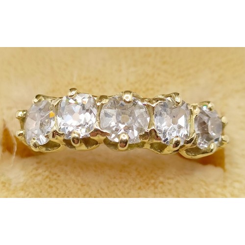 207 - An 18ct gold and five stone diamond half hoop ring, ring size J