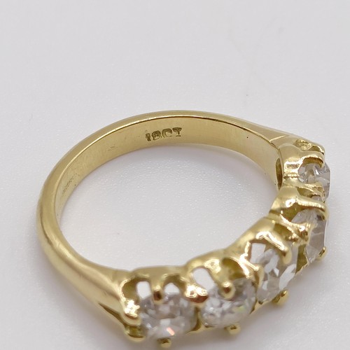 207 - An 18ct gold and five stone diamond half hoop ring, ring size J