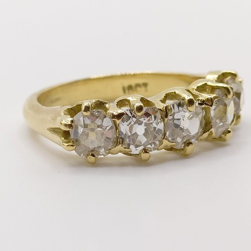 207 - An 18ct gold and five stone diamond half hoop ring, ring size J