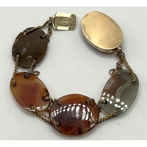 215 - An agate and yellow coloured metal bracelet