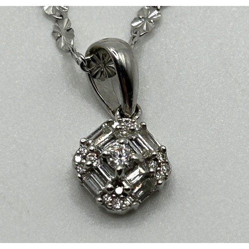 235 - An 18ct white gold and diamond pendant, by Illiana, on a chain