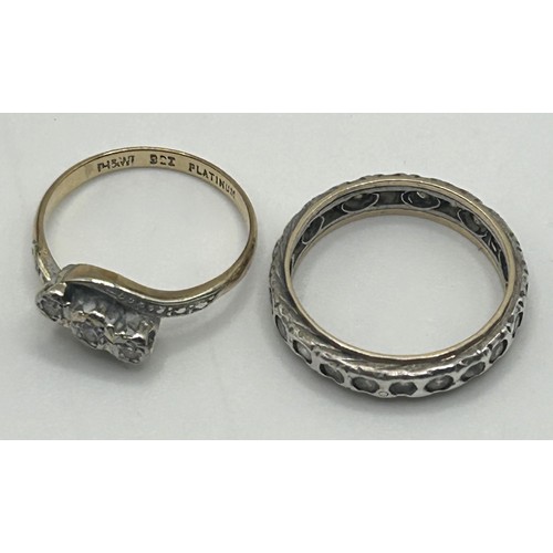 239 - A 9ct gold and platinum three stone diamond ring, ring size M, and an eternity ring, ring size O (2)