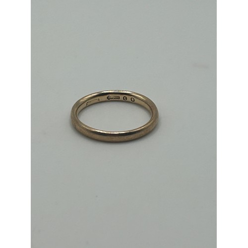 4 - A 9ct  gold wedding band, ring size M