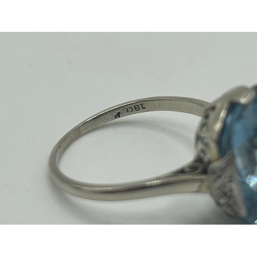 19 - An 18ct white gold and aquamarine ring, ring size M, in a vintage jewellery box