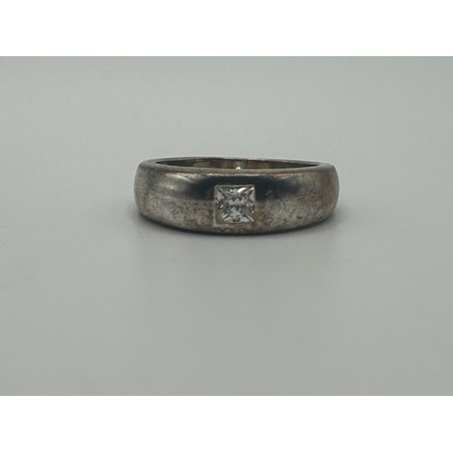 2 - ***Withdrawn*** A silver coloured metal and diamond gypsy set ring, ring size L