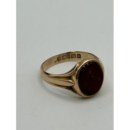 3 - A 9ct gold and carved red stone Masonic signet ring, ring size U, in a modern jewellery box