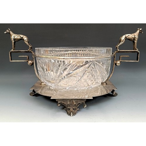 351 - A silver plated and cut glass trophy bowl, with greyhound handles, 37 cm wide