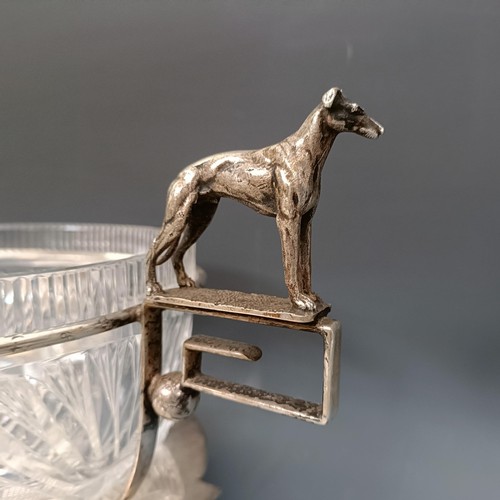 351 - A silver plated and cut glass trophy bowl, with greyhound handles, 37 cm wide