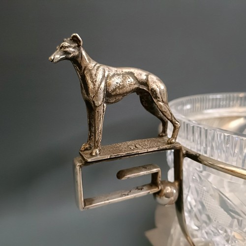 351 - A silver plated and cut glass trophy bowl, with greyhound handles, 37 cm wide