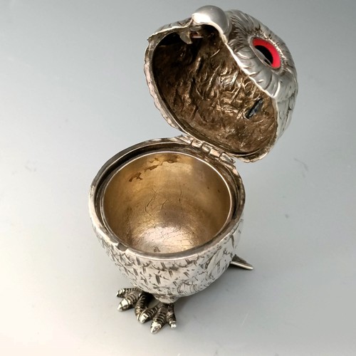 358 - A silver coloured metal novelty mustard, in the form of an owl, with glass eyes, 9 cm high