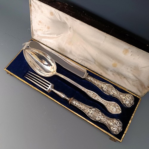 368 - A Continental silver christening set, comprising a knife, fork and spoon, cased, case decorated with... 