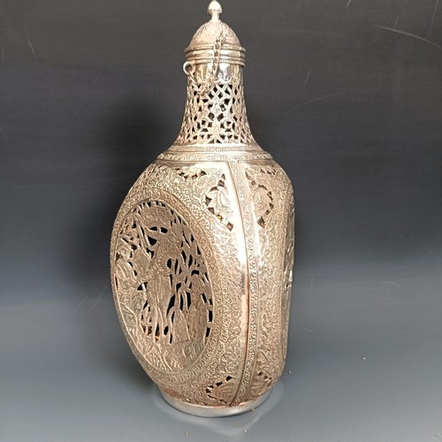 370 - A Persian silver and glass decanter, decorated figures, 25 cm high