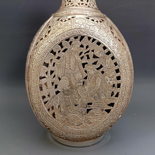 370 - A Persian silver and glass decanter, decorated figures, 25 cm high