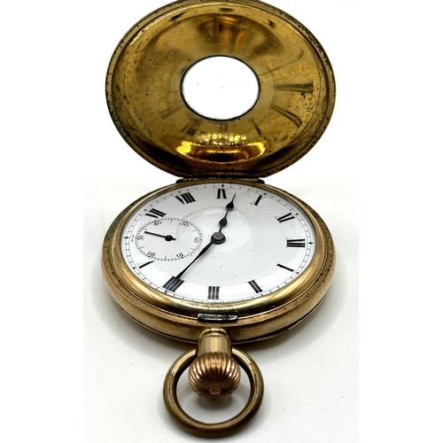 312 - A gold plated half hunter pocket watch, cased