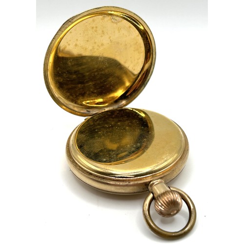 312 - A gold plated half hunter pocket watch, cased