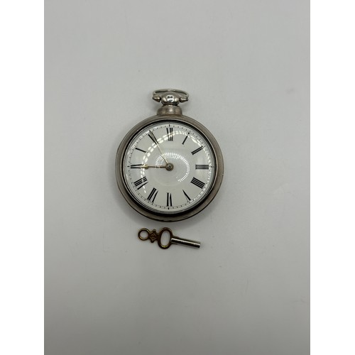 318 - A Victorian silver pair cased pocket watch, London 1853, with a key