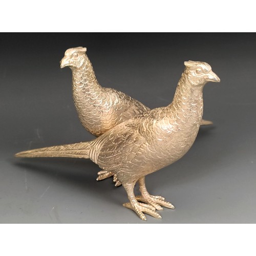 390 - A pair of modern silver pheasants, Birmingham 1974, 9.63 ozt, 16 cm (2)