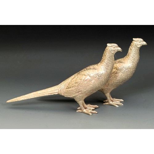 390 - A pair of modern silver pheasants, Birmingham 1974, 9.63 ozt, 16 cm (2)