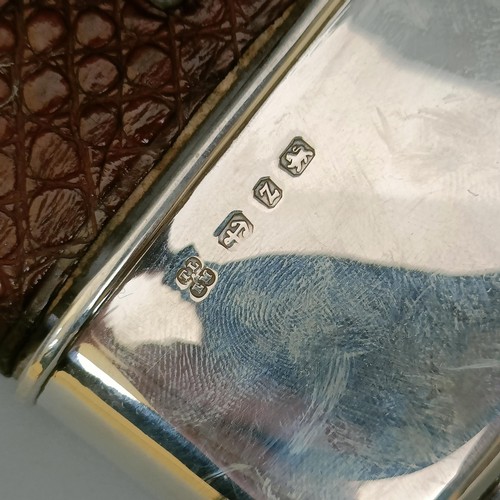 407 - A George V silver glass and leather hip flask, Birmingham 1924