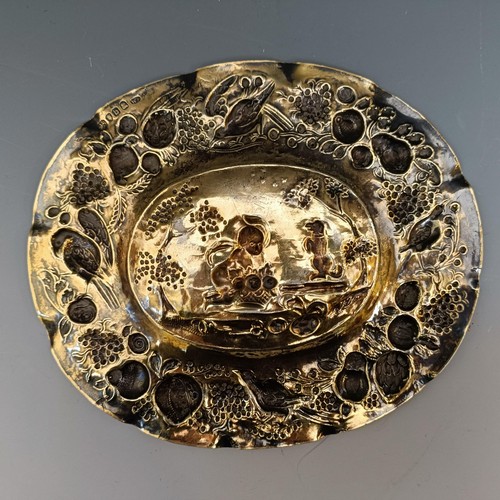 411 - A George  III silver gilt sideboard dish, decorated child with a basket of fruit and an attendant do... 