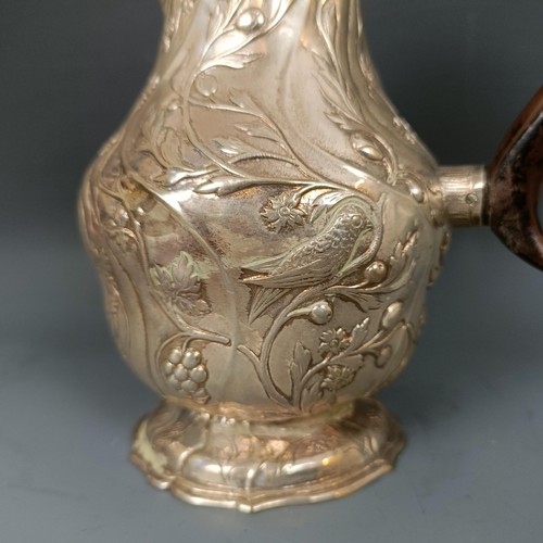 415 - An 18th century Continental silver coffee pot, with a carved wooden handle, possibly Augsburg, 340 g