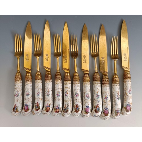 416 - A set of six Continental gilt metal and porcelain pistol handled knives, and a set of six matching f... 