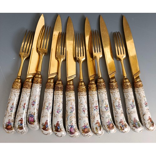 416 - A set of six Continental gilt metal and porcelain pistol handled knives, and a set of six matching f... 