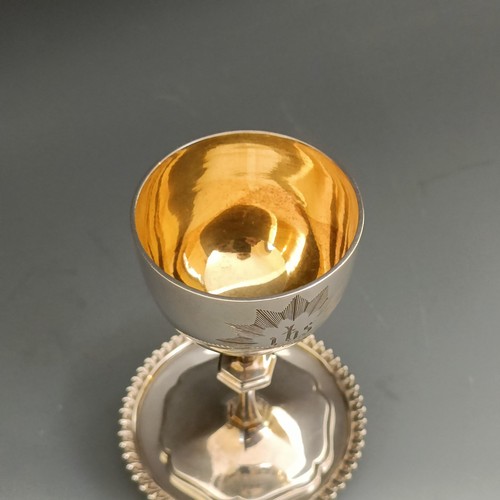 423 - A Victorian silver communion set, comprising a goblet and a stand, London 1859, 2.9 ozt (2)