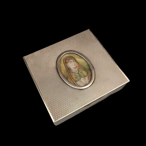 432 - An Indian silver coloured metal box, the centre inset with a portrait, Ivory Exemption registration ... 