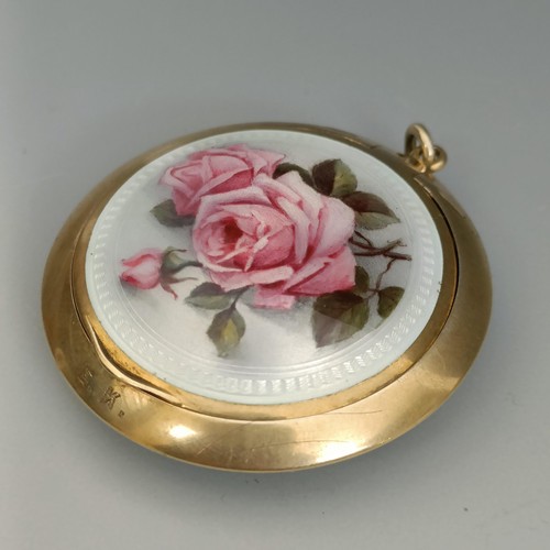 447 - A Continental silver gilt coloured metal and enamel compact, decorated roses, all in 37.1 g