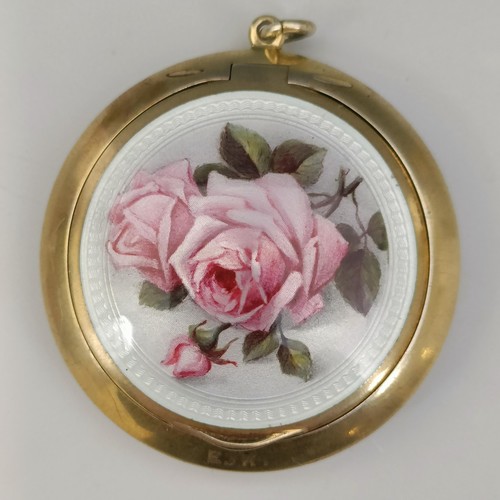 447 - A Continental silver gilt coloured metal and enamel compact, decorated roses, all in 37.1 g