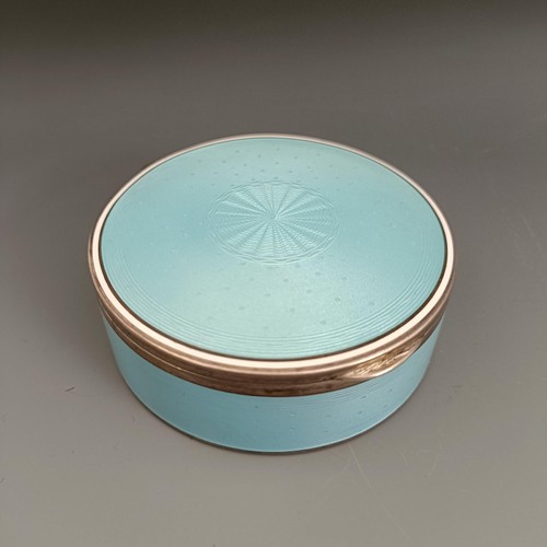 454 - A Continental silver coloured metal and blue enamel circular box, all in 170 g