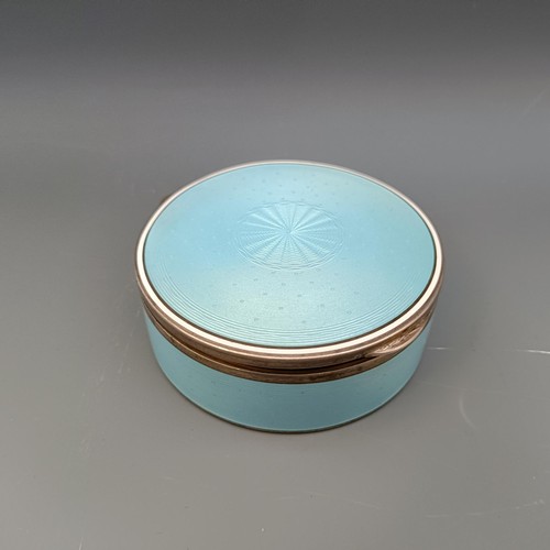 454 - A Continental silver coloured metal and blue enamel circular box, all in 170 g